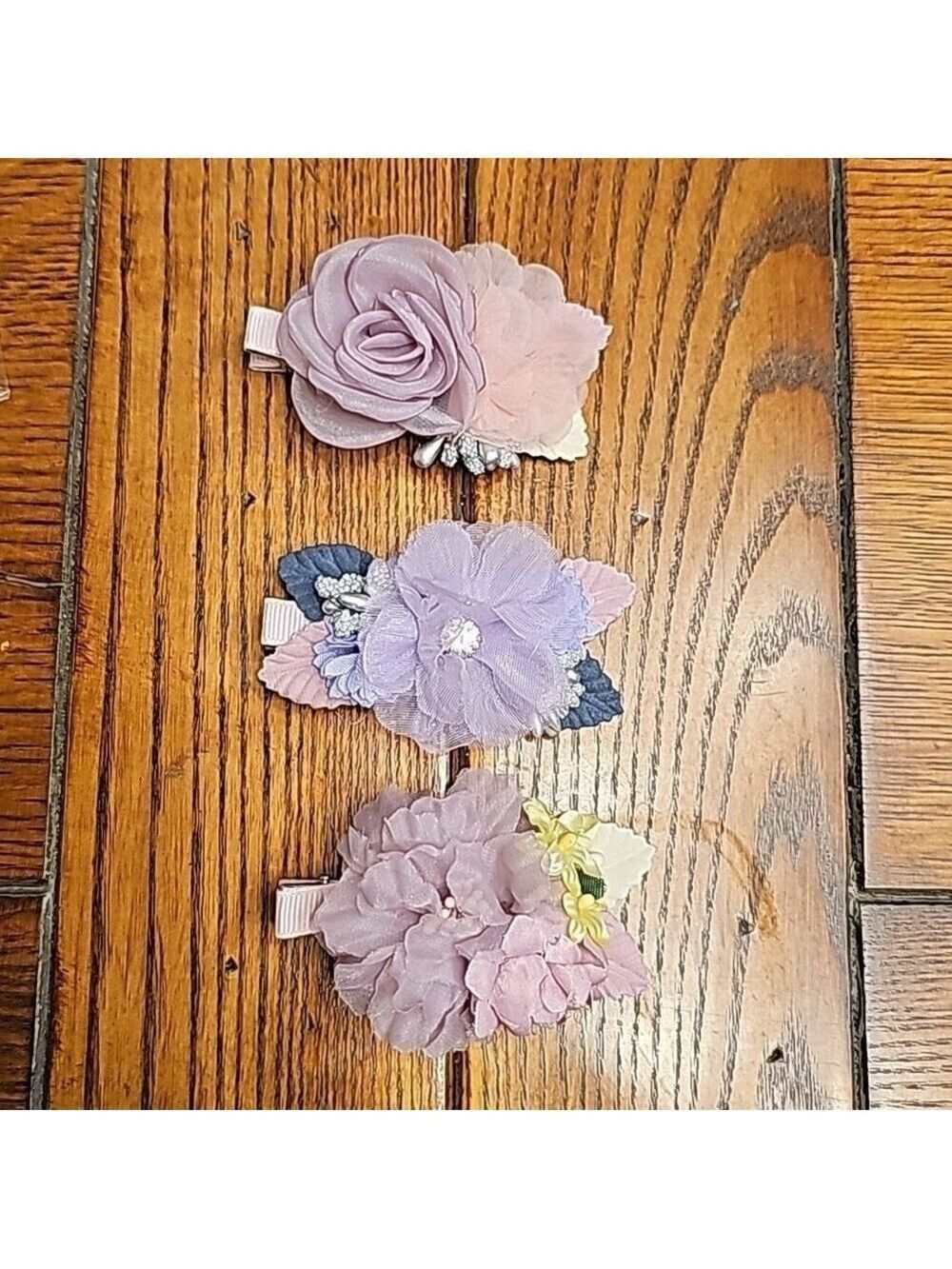3 cute hair clips in mostly purple